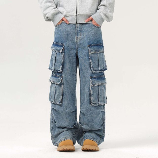 Baggy denim cargo pants by custom jeans manufacturer with mid-rise fit, button-and-zip fly, belt loops, and side cargo pockets