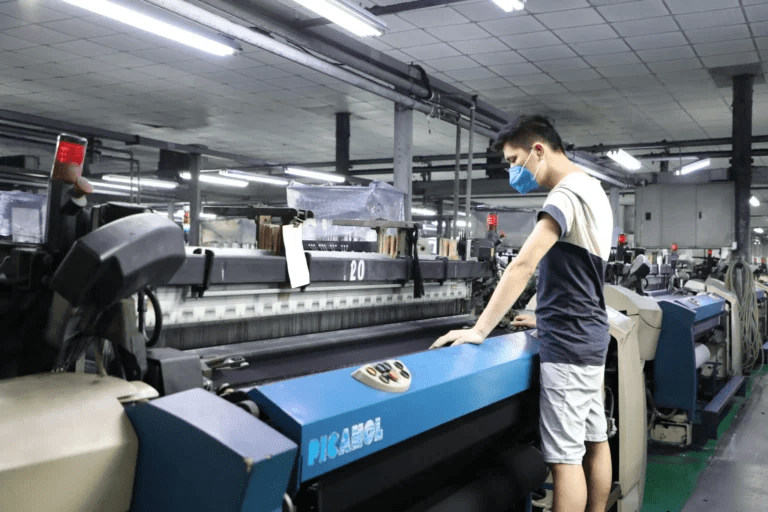 Laboratory testing lightweight denim fabric for strength, colorfastness, and performance