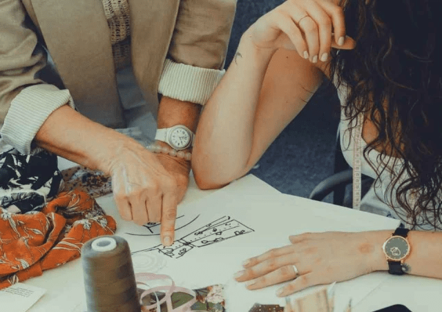 Fashion design team collaborating on new garment concepts and seasonal collections