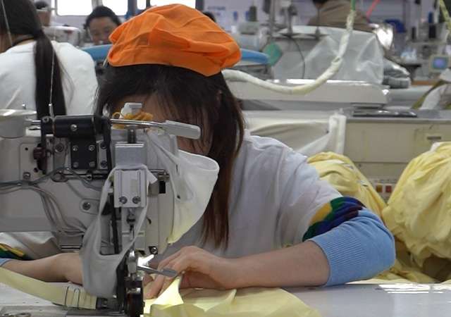 Detailed stitching and seam finishing on high quality maxi dress production