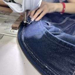 Close-up of reinforced stitching and seam finishing on a custom maxi dress
