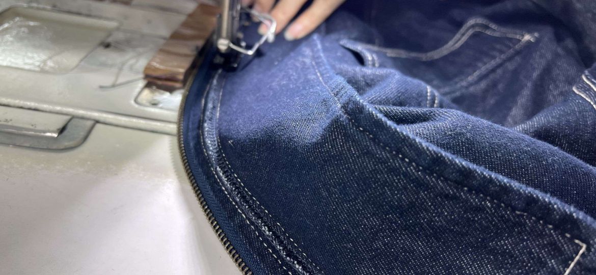 Close-up of reinforced stitching and seam finishing on a custom maxi dress