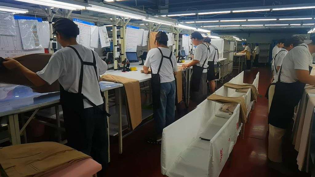 Final quality control at Newasia Garment Factory