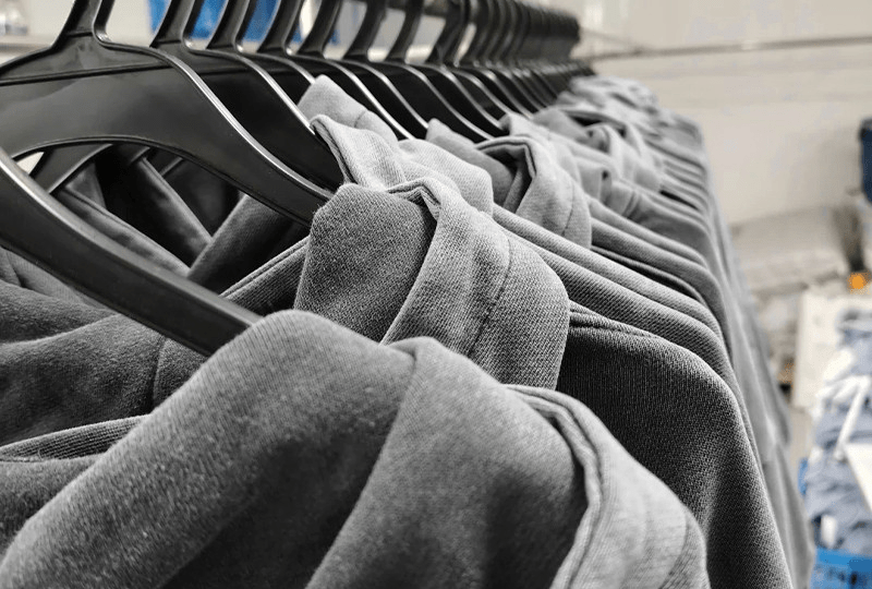 Close up view of hoodie seam stitching and reinforced construction details