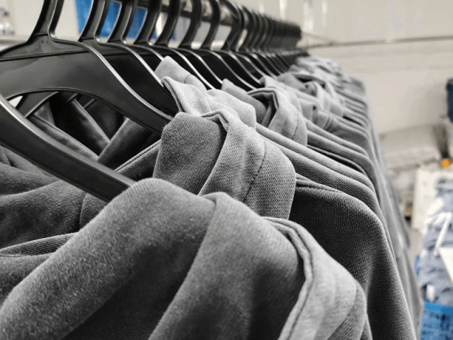 Close up view of hoodie seam stitching and reinforced construction details