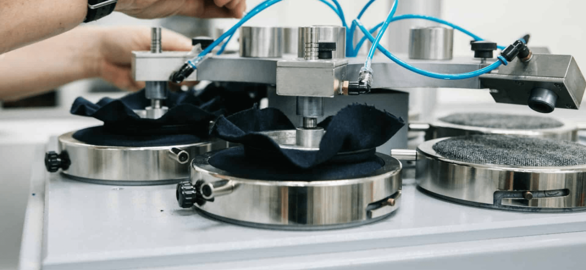 Textile laboratory testing training wear fabrics for durability and performance standards
