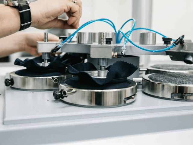 Textile laboratory testing training wear fabrics for durability and performance standards