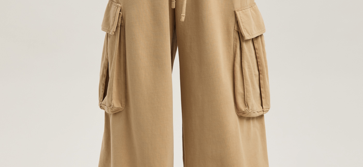 Industrial workers wearing durable cargo pants with multiple utility pockets for construction and warehouse operations