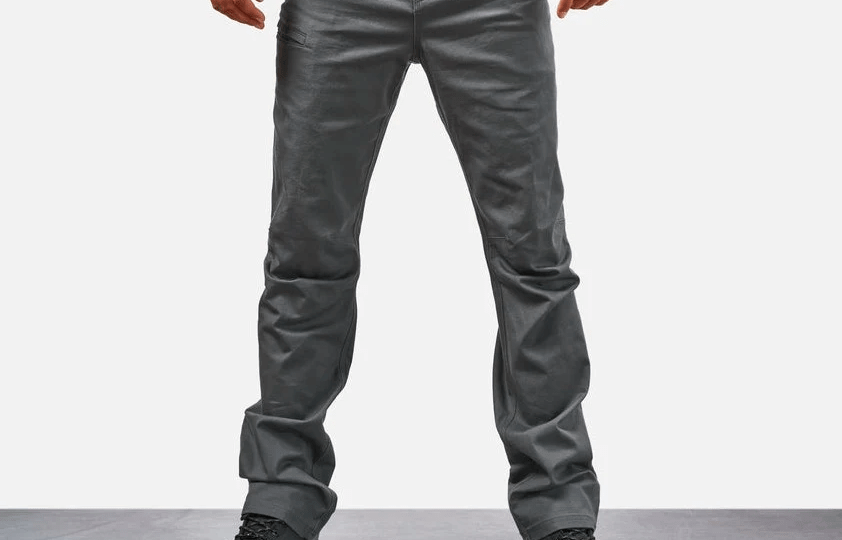Close-up of reinforced double-needle stitching securing work pant pocket attachment for enhanced durability