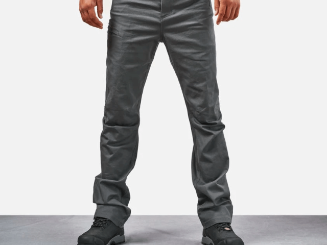 Close-up of reinforced double-needle stitching securing work pant pocket attachment for enhanced durability