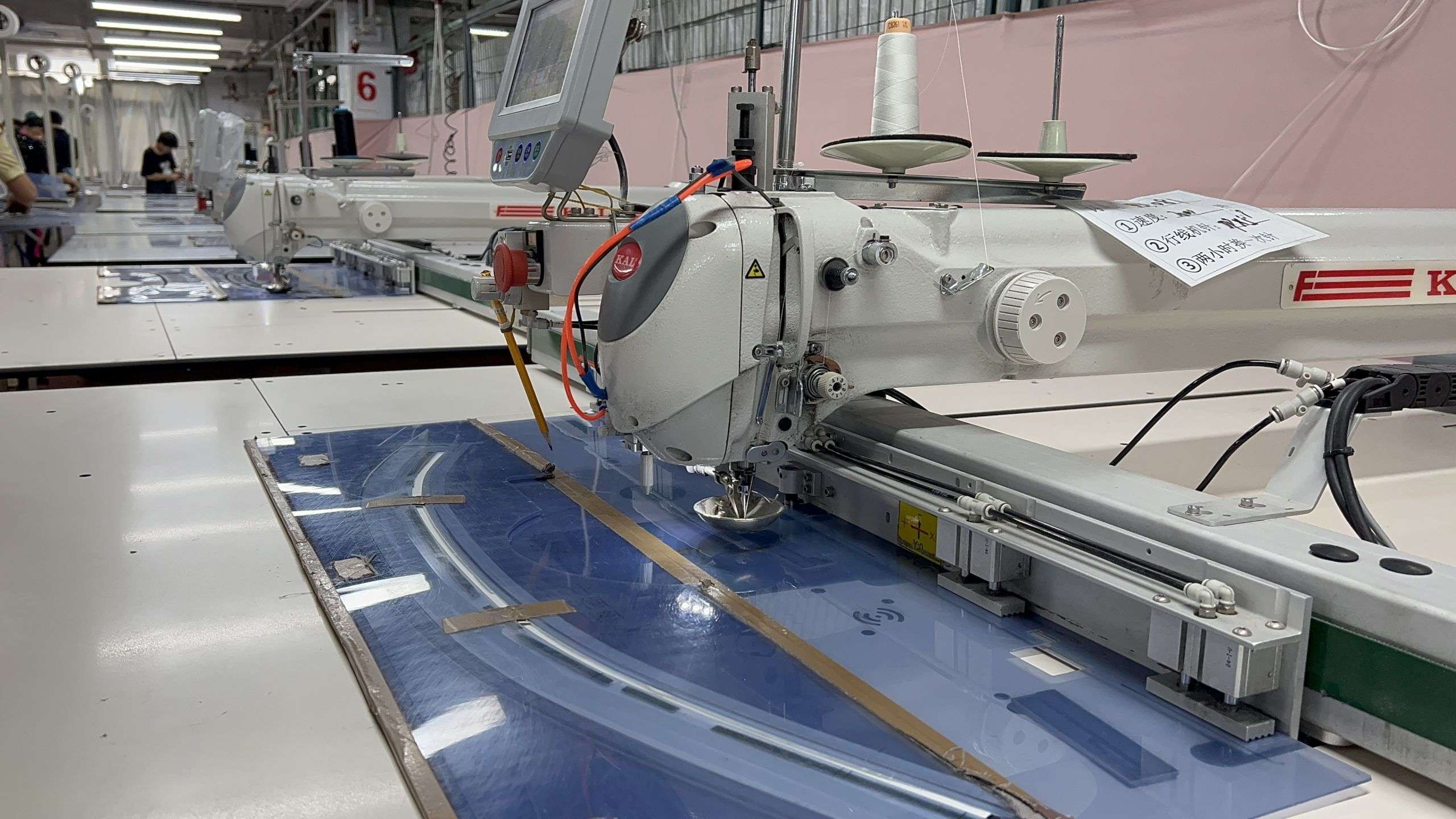Denim garment cutting preparation at New Asia Garment