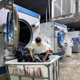 Professional denim washing process creating fashionable finishes and consistent garment quality