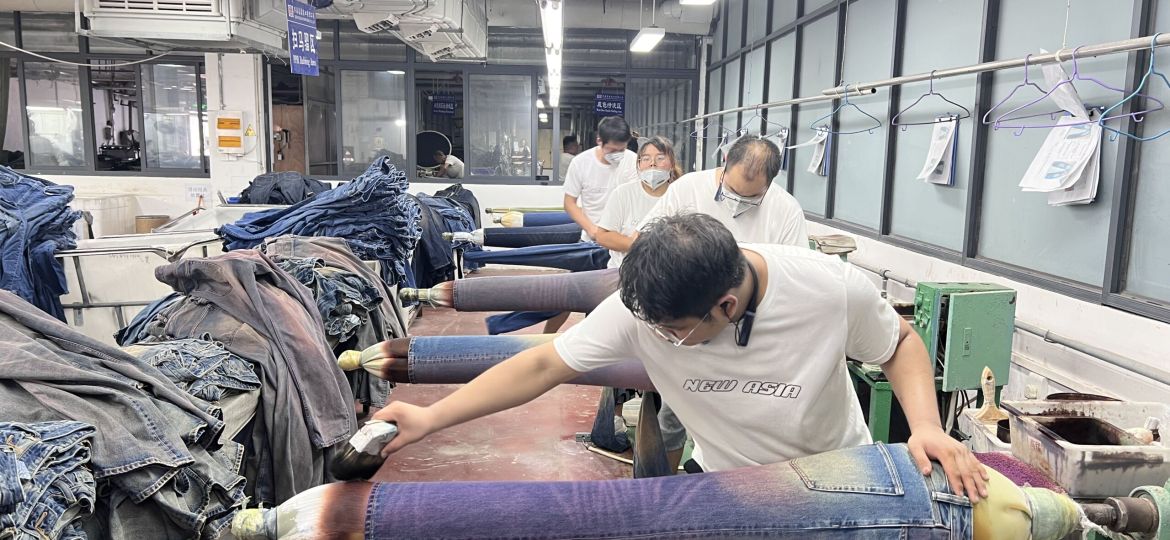 Handcrafted whisker distress detailing on premium denim jeans