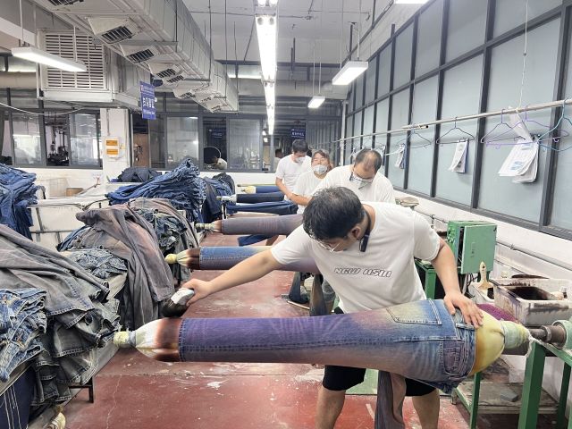 Handcrafted whisker distress detailing on premium denim jeans