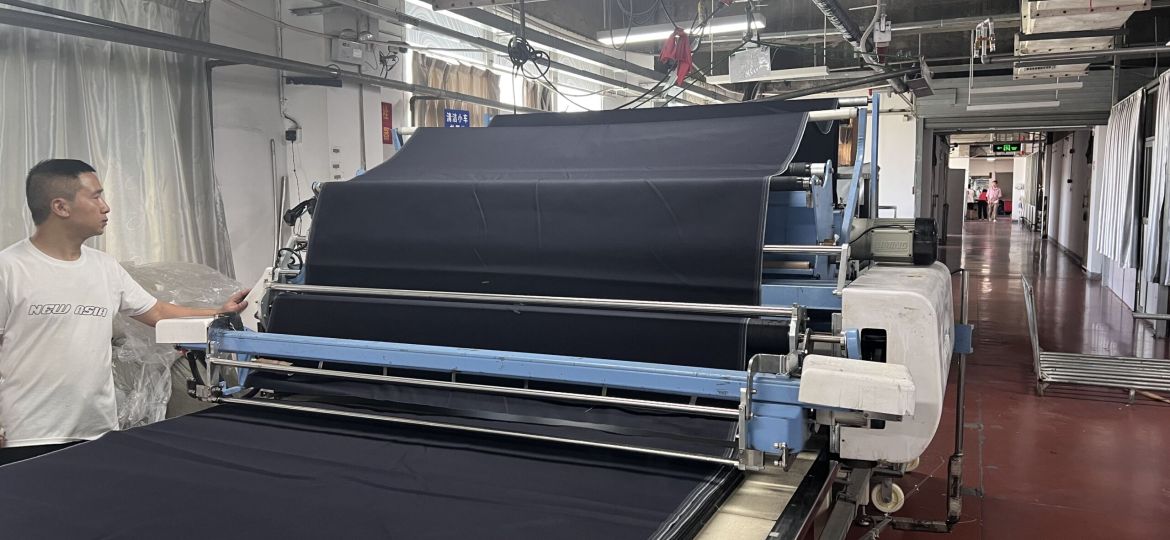 Denim fabric inspection checking color shade texture weight and material consistency before production