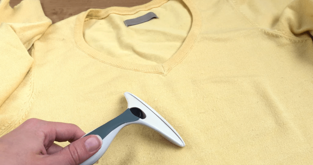 Dense cotton knit structure engineered to reduce fiber fuzz and fabric pilling