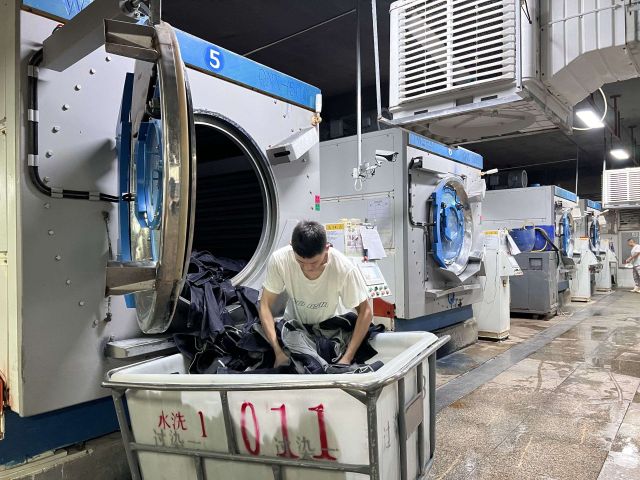 Raw denim jeans shrinking slightly after washing due to cotton fiber contraction