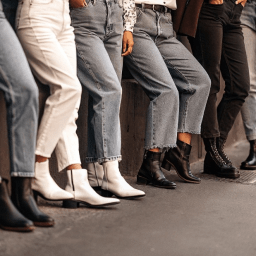 Side by side comparison of black denim jeans and blue denim jeans styles