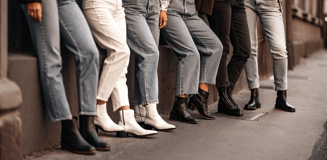 Side by side comparison of black denim jeans and blue denim jeans styles