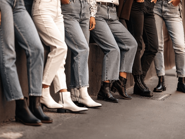 Side by side comparison of black denim jeans and blue denim jeans styles