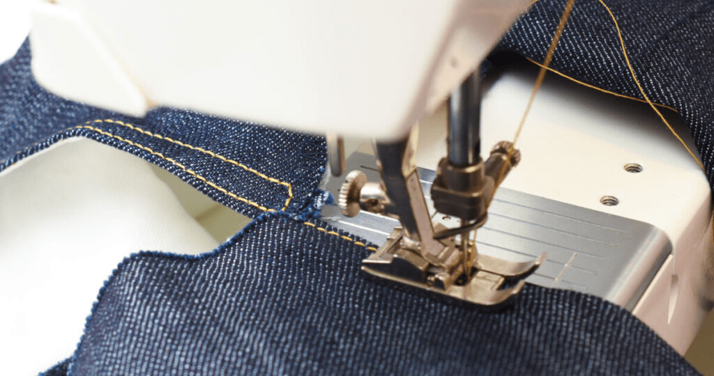 Close-up of jeans construction lines showing stitching and panel design