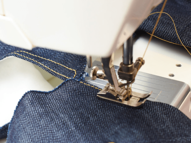 Close-up of jeans construction lines showing stitching and panel design