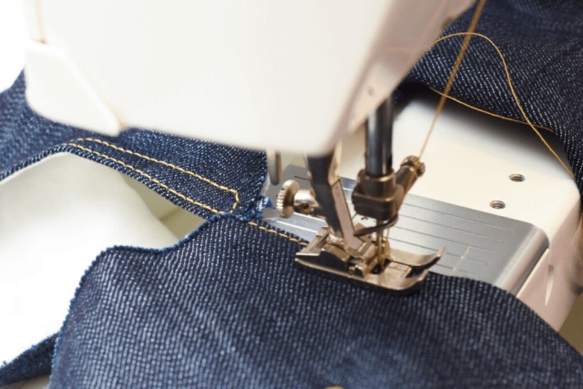 Close-up of jeans construction lines showing stitching and panel design