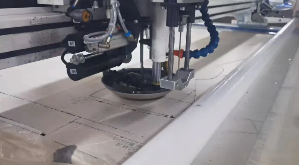 Industrial cutting process for mass production of denim jeans