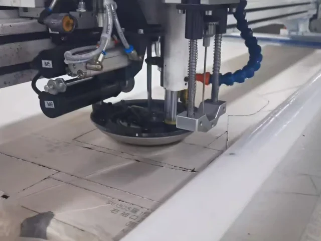 Industrial cutting process for mass production of denim jeans