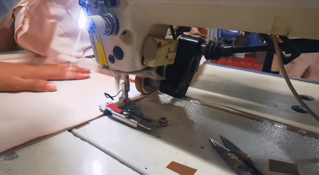 Skilled workers sewing garments with professional stitching techniques and production control