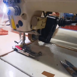 Skilled workers sewing garments with professional stitching techniques and production control
