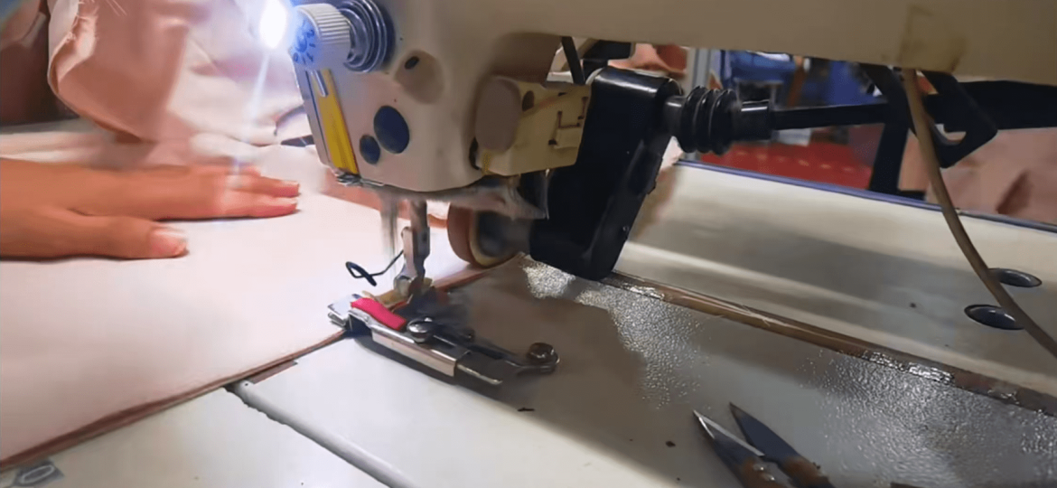 Skilled workers sewing garments with professional stitching techniques and production control