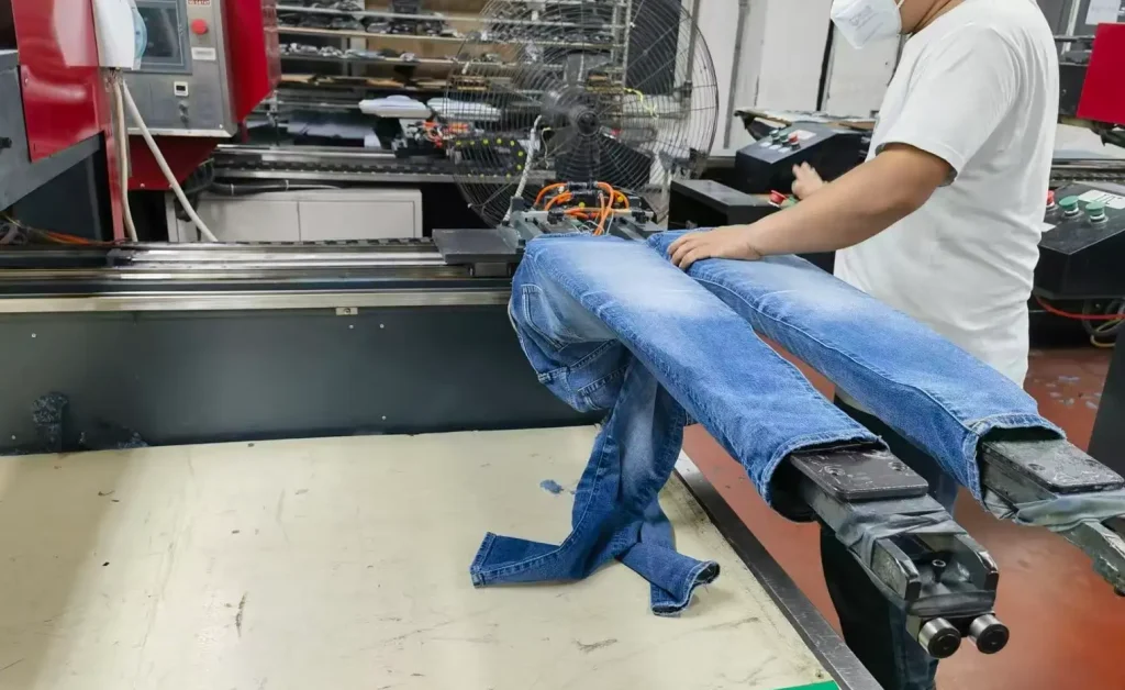 Distressing and vintage finishing process for custom denim jeans