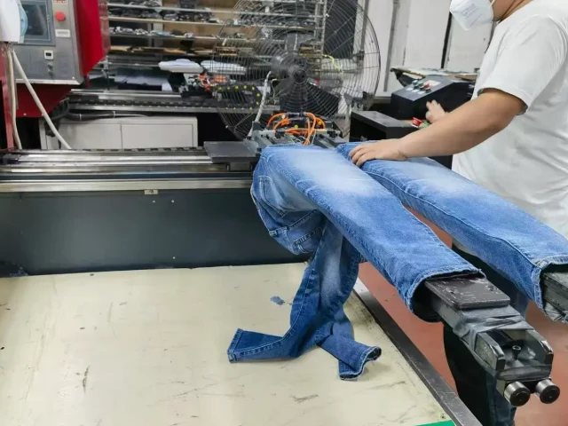 Distressing and vintage finishing process for custom denim jeans