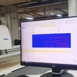 Automated denim fabric cutting process for precise garment pattern shaping