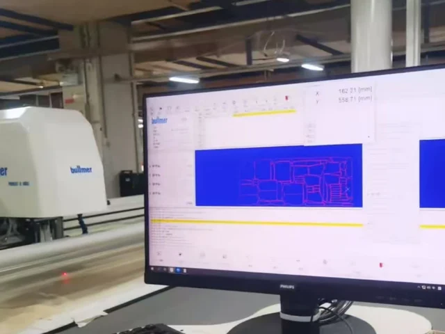 Automated denim fabric cutting process for precise garment pattern shaping