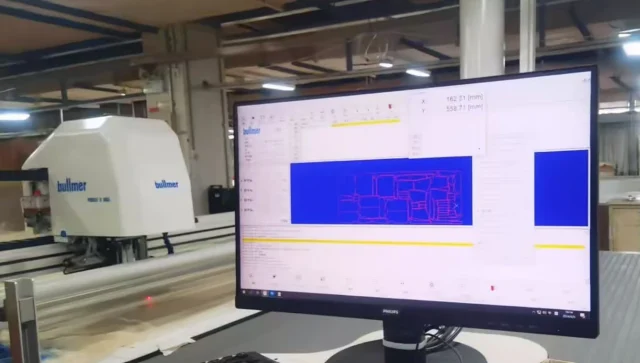 Automated denim fabric cutting process for precise garment pattern shaping