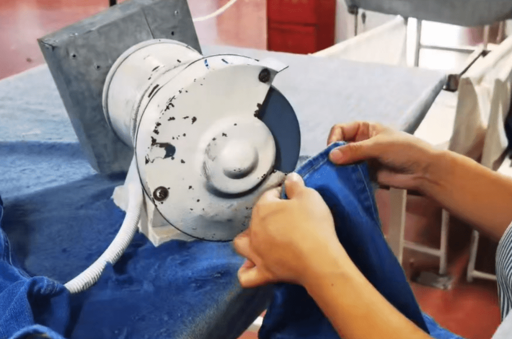 Denim finishing process improving garment appearance and comfort