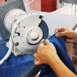Denim finishing process improving garment appearance and comfort