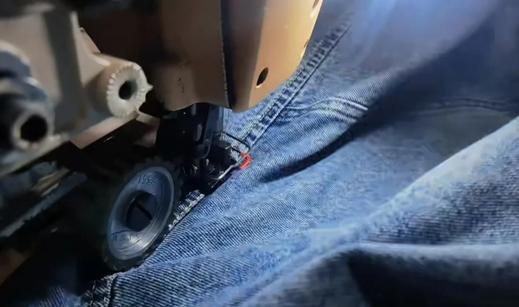 Reinforced stitching detail showing durable construction of denim garments