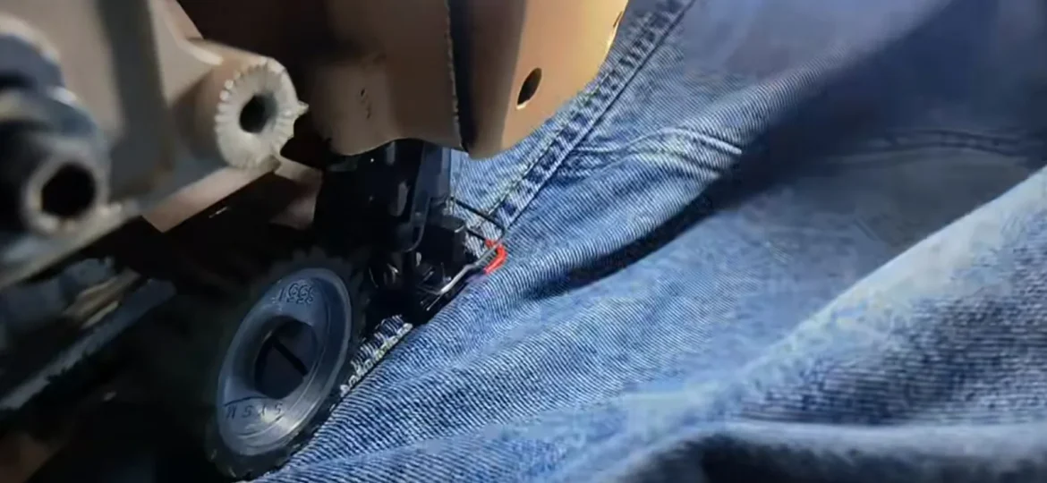 Reinforced stitching detail showing durable construction of denim garments