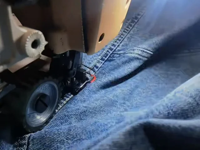 Reinforced stitching detail showing durable construction of denim garments