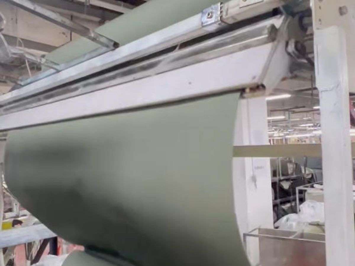 Fabric inspection before OEM garment production at New Asia Garment