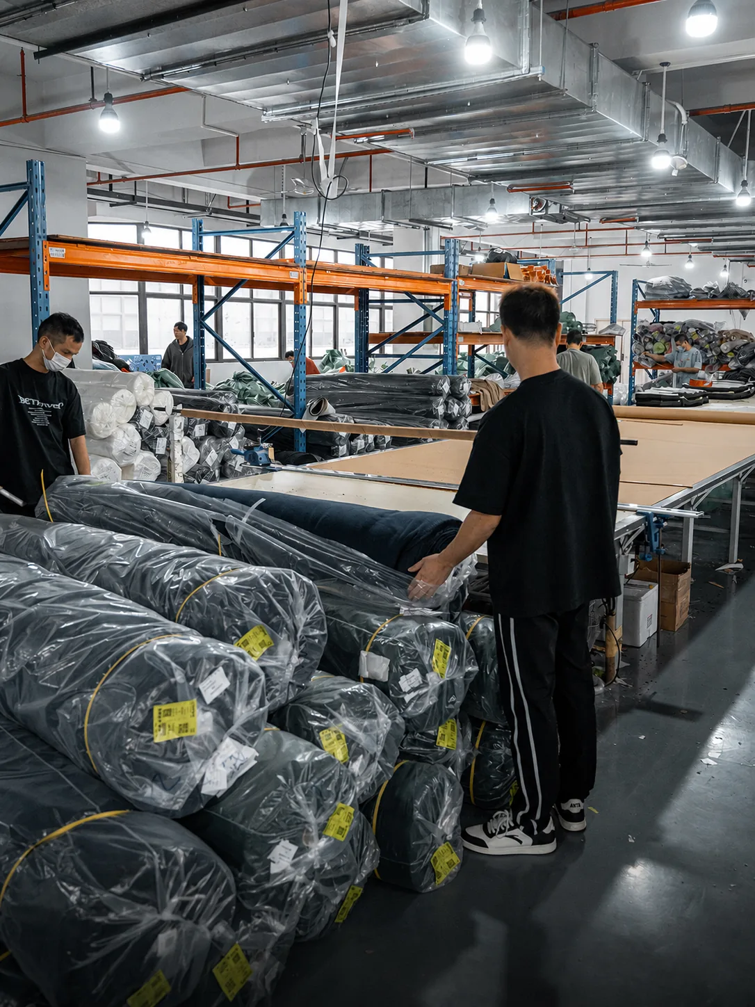Fabric roll handling before OEM apparel production at New Asia Garment