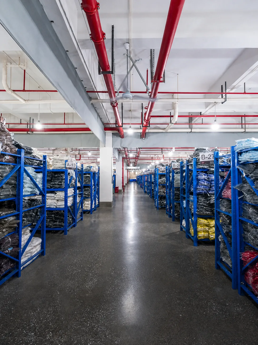 Finished apparel warehouse aisle at New Asia Garment