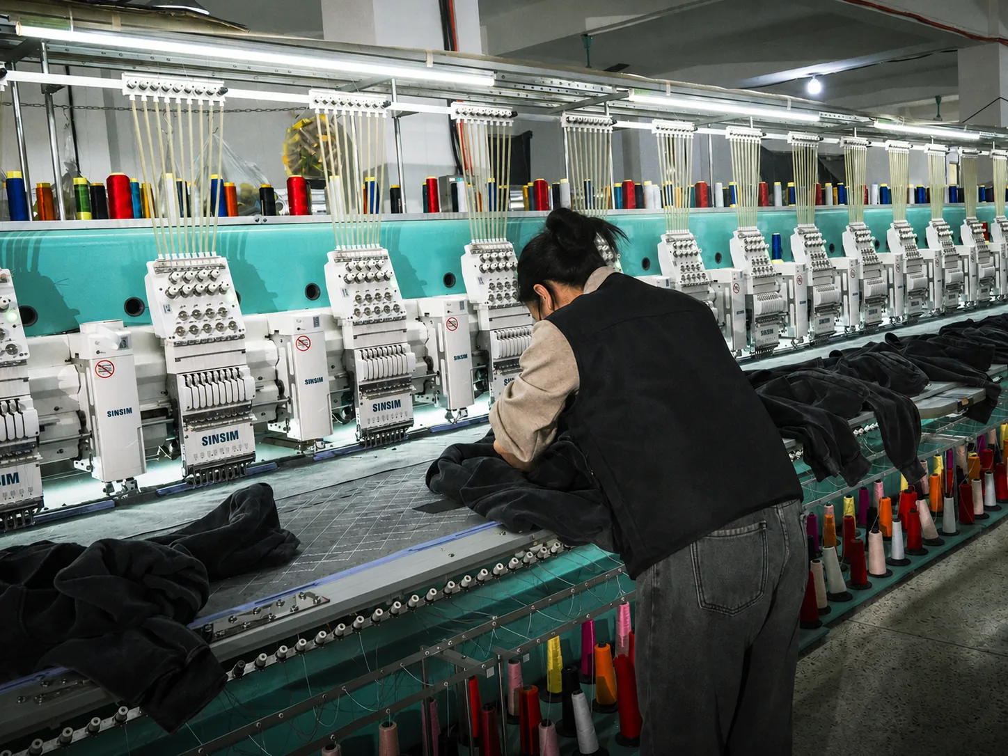 Multi-head embroidery production for ODM apparel at New Asia Garment