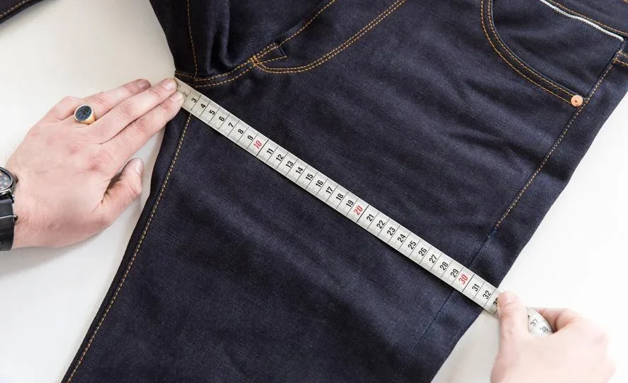 Denim hip and thigh measurement points illustrating fit-critical garment dimensions and tolerance ranges