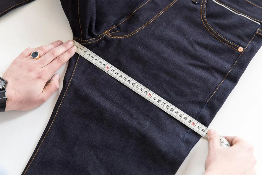 Denim hip and thigh measurement points illustrating fit-critical garment dimensions and tolerance ranges